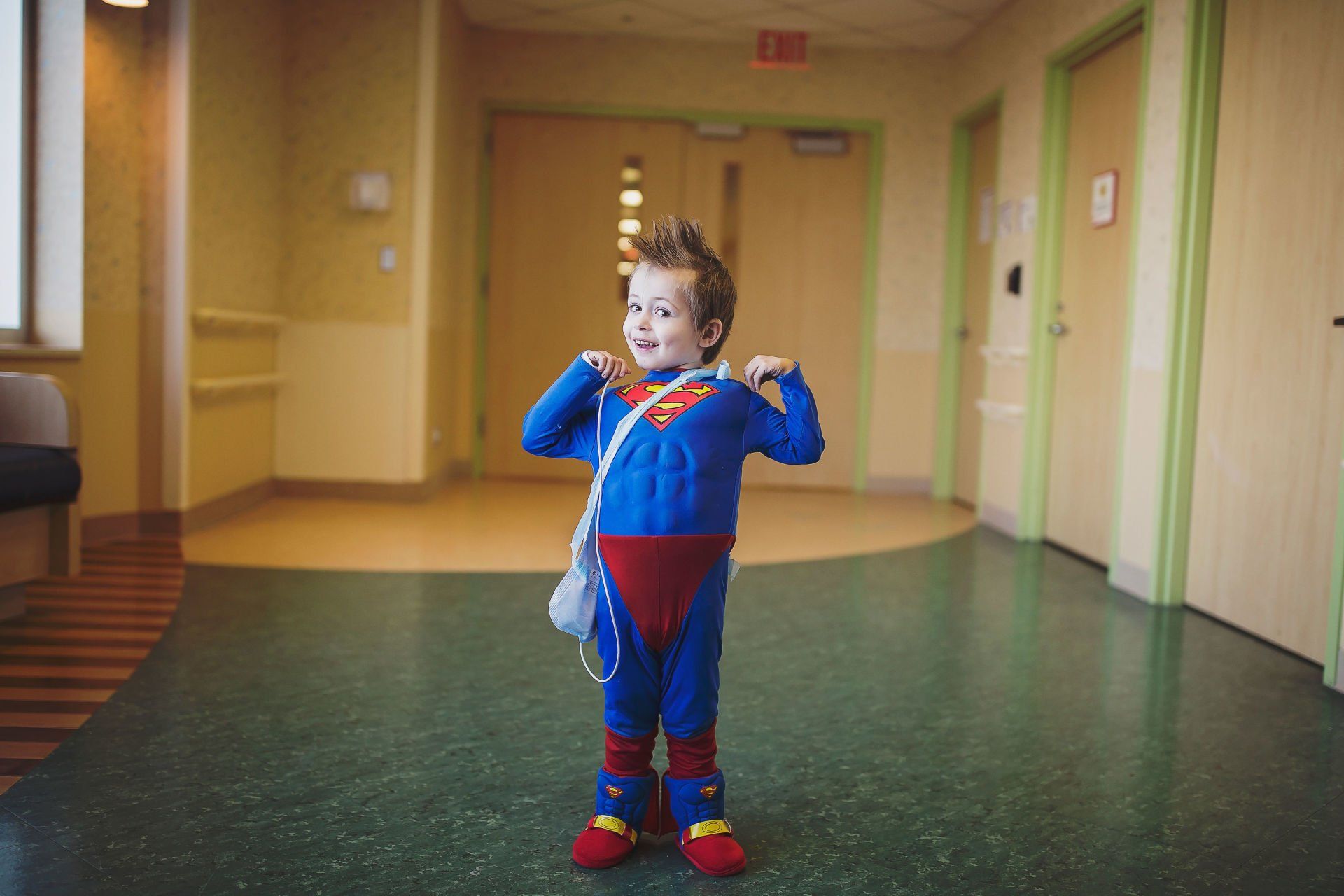 chd child in superman costume world of broken hearts