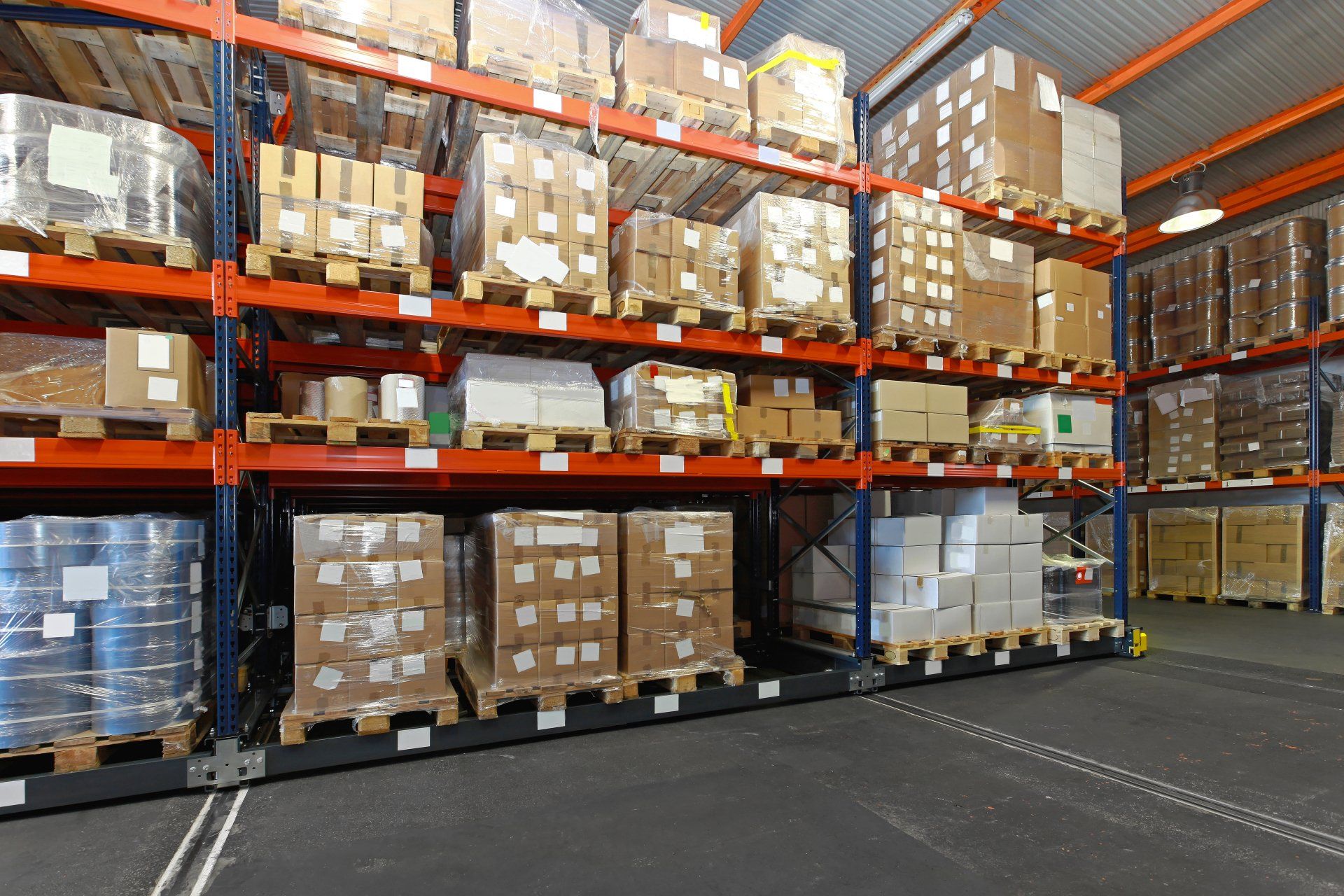 A large warehouse filled with lots of boxes and pallets