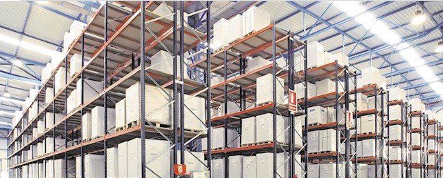 A large warehouse filled with lots of shelves and boxes.