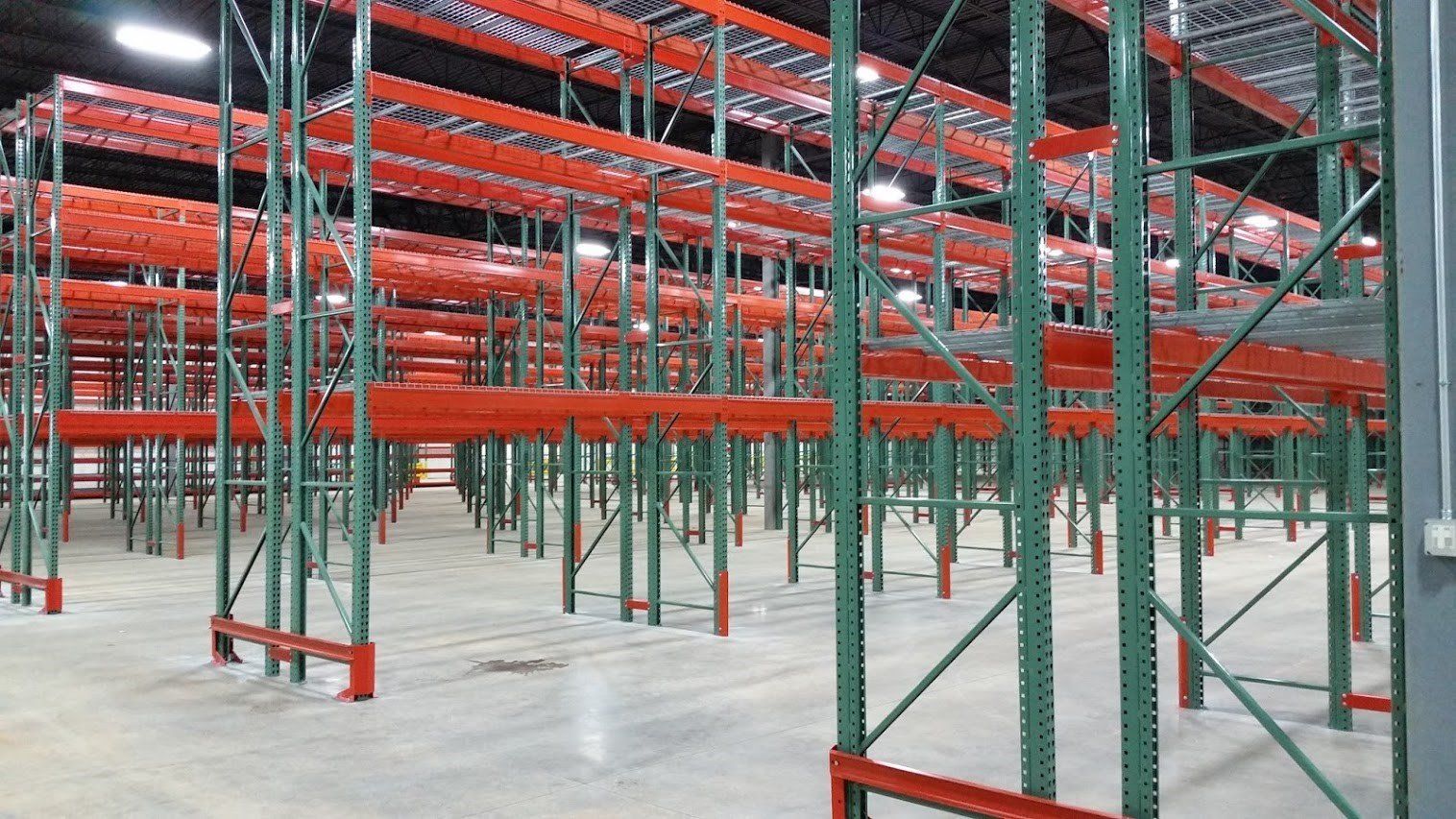 A large warehouse with lots of shelves and racks