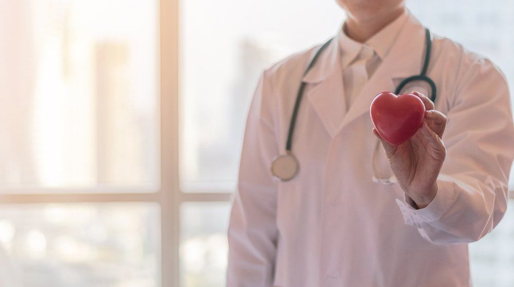 Cardiologist — Cardiologist Doctor Holding Red Heart In Big Spring, TX Cardiologist — Cardiologist Doctor Holding Red Heart In Big Spring, TX