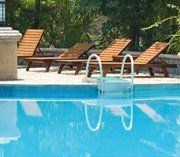 Pool with Brown Chairs - Pump Repair in Apollo Beach, FL Pool with Brown Chairs - Pump Repair in Apollo Beach, FL