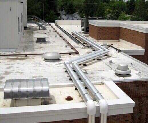 Pipes on Commercial Roof — Hillsdale, MI — Braman Roofing
