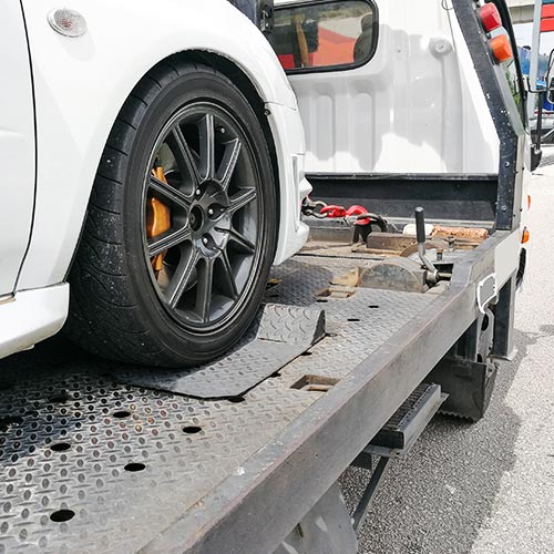 Experienced Towing Service — Car Being Tow by a Towing Truck in Canoga Park, CA Experienced Towing Service — Car Being Tow by a Towing Truck in Canoga Park, CA