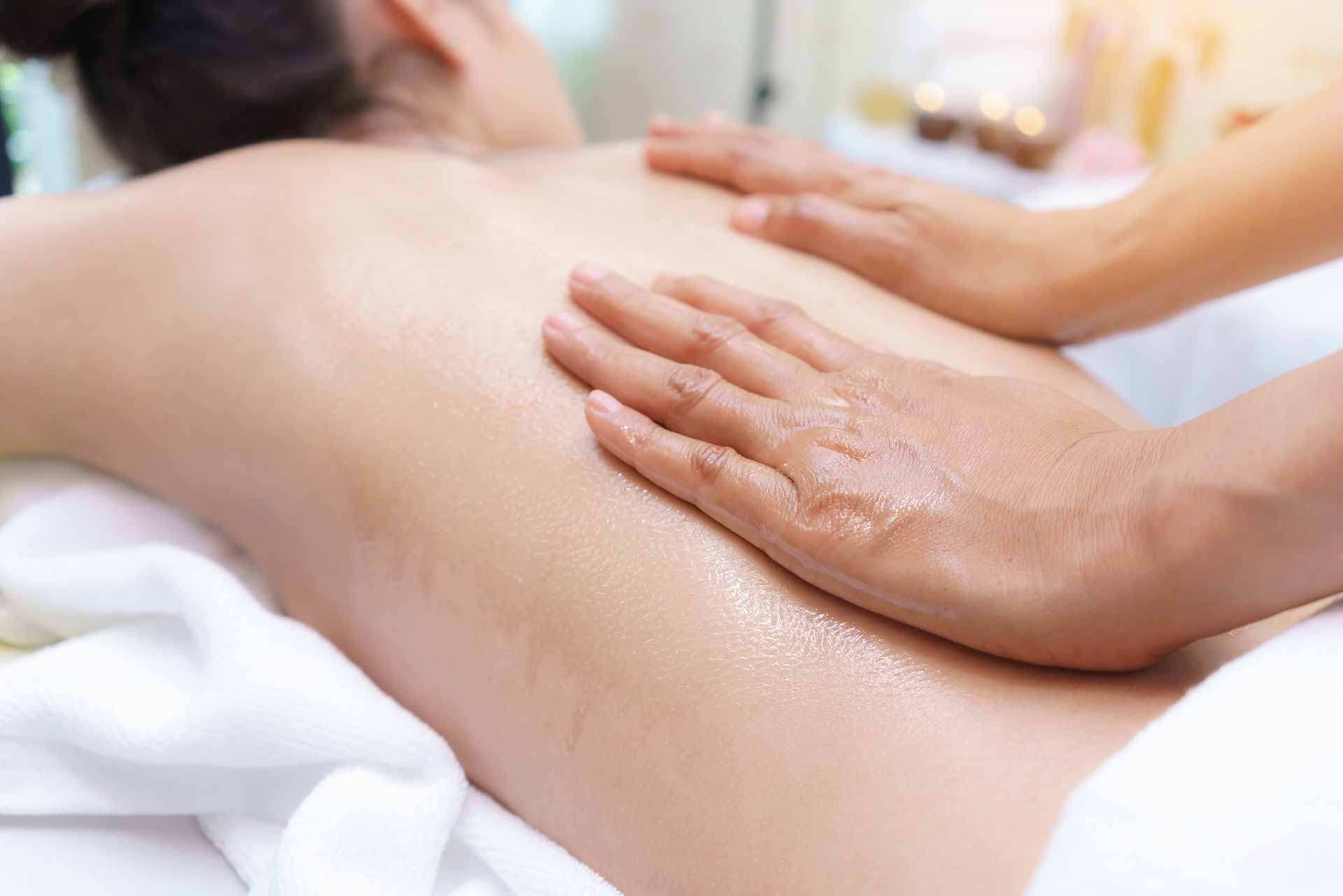 A woman is getting a massage at a spa.