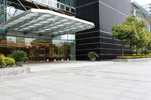 Trees In Front of a Commercial Building — Hempstead, NY — Harder Services Inc