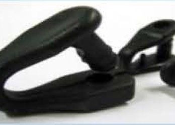 Black spring-loaded clamp on a white background
