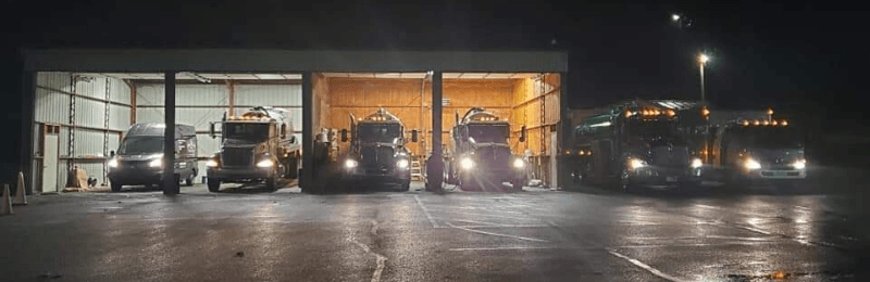 Residential and Commercial Septic Pumping Trucks at Night | 24/7 Services