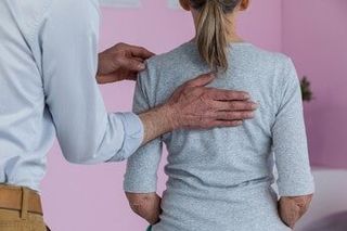 Physiotherapist giving neck massage to female patient — Chiropractic in Los Angeles, CA Physiotherapist giving neck massage to female patient — Chiropractic in Los Angeles, CA