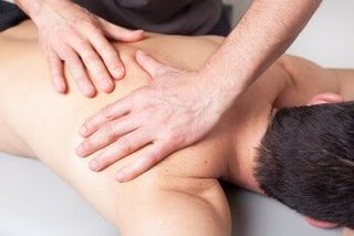 Back massage given to a young man — Chiropractic in Los Angeles, CA Back massage given to a young man — Chiropractic in Los Angeles, CA