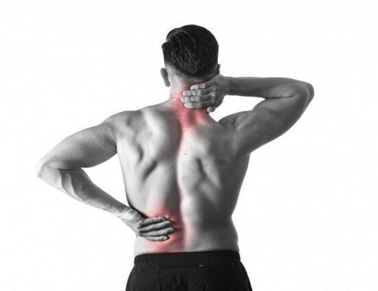 Man holding sore neck massaging cervical area suffering body pain — Chiropractic in Los Angeles, CA Man holding sore neck massaging cervical area suffering body pain — Chiropractic in Los Angeles, CA