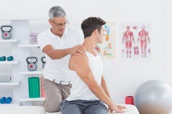 Doctor doing back adjustment — Chiropractic in Los Angeles, CA Doctor doing back adjustment — Chiropractic in Los Angeles, CA