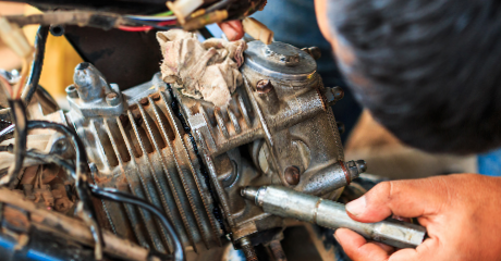 Man repairing a motorcycle