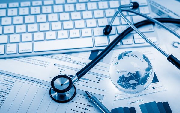 medical items and chart over keyboard