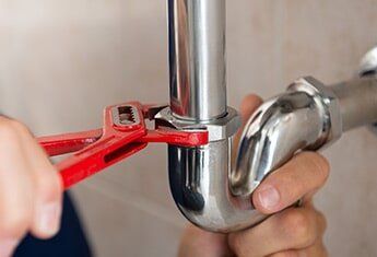 Plumber Fixing Pipe — Plumbing Repair in Costa Mesa, CA