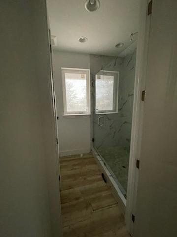 guest bathroom with frameless shower enclosure