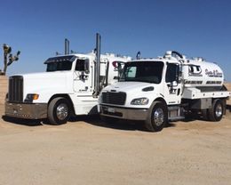 Two trucks are facing left Two trucks are facing left