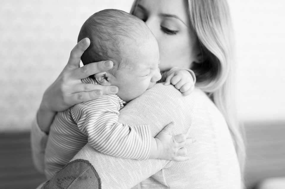 mother holding newborn baby - Heavenly Hands Birthing Center