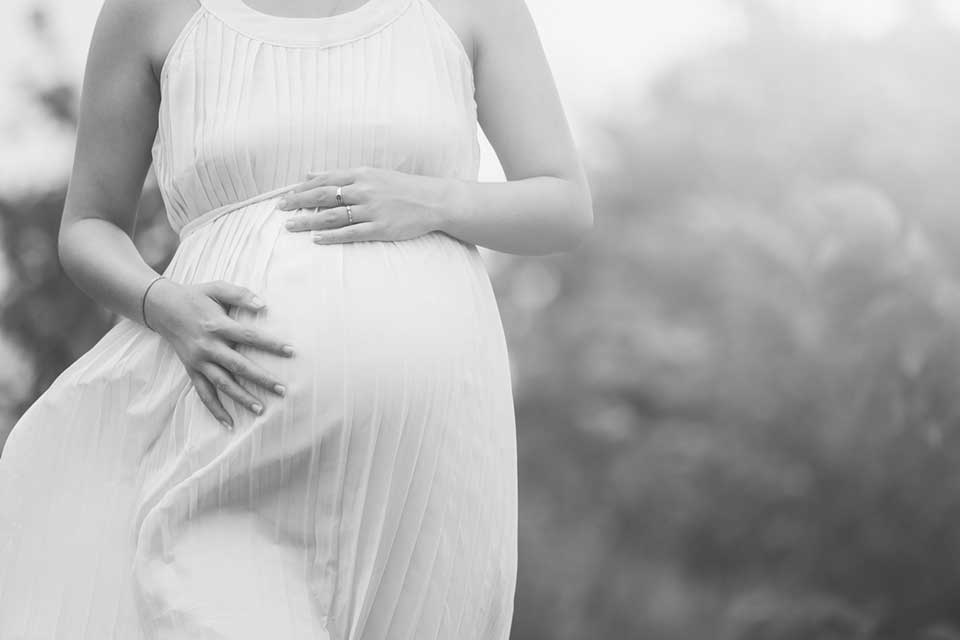 pregnant woman in dress - heavenly hands birthing center