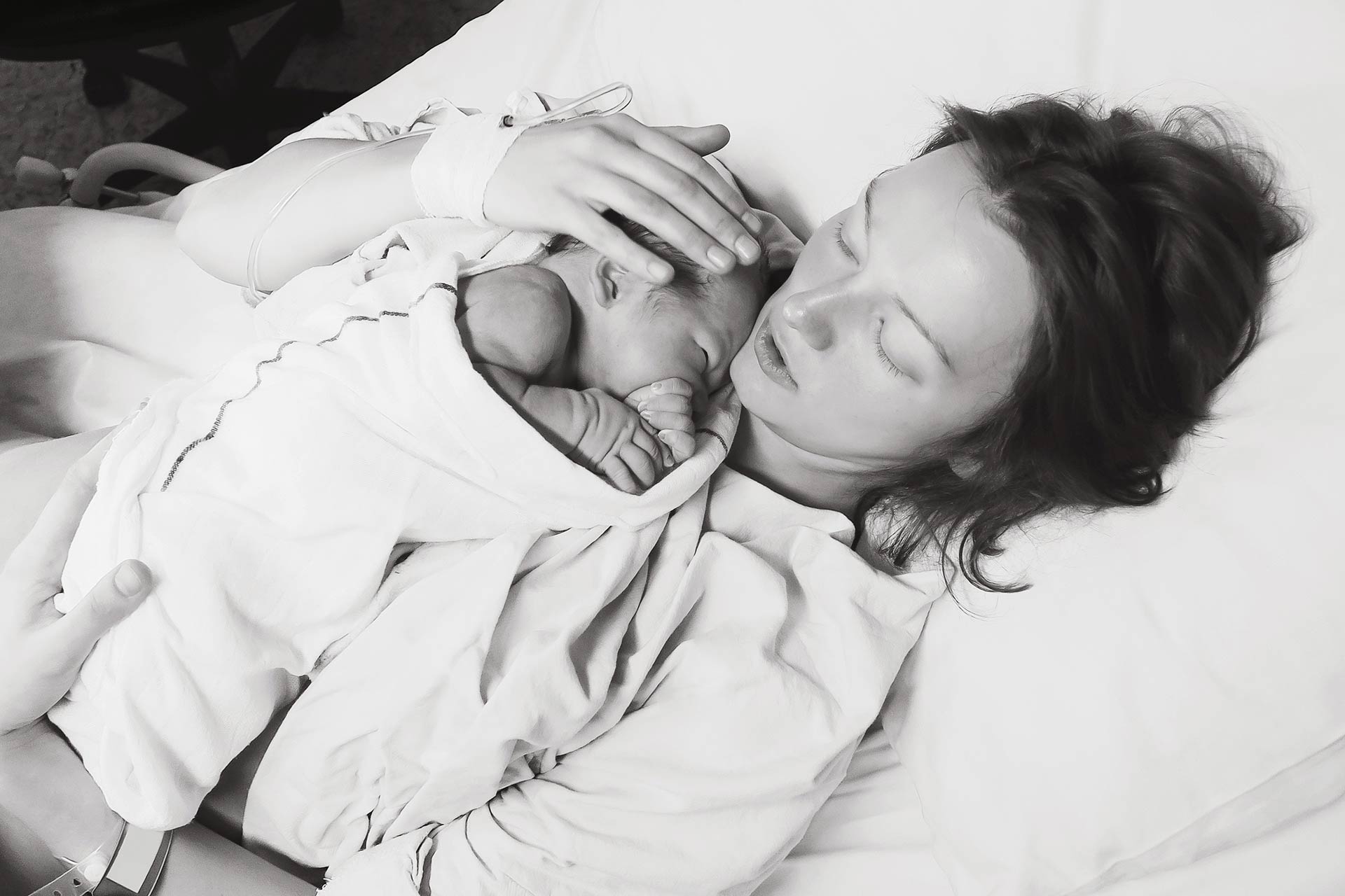 Mother holding baby just after birth at Heavenly Hands Birthing Center - Rockwall, TX