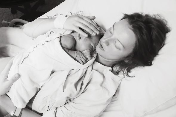 Mother holding baby just after birth at Heavenly Hands Birthing Center - Rockwall, TX
