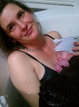 mother with newborn baby just after water birth - Heavenly Hands Birthing Center