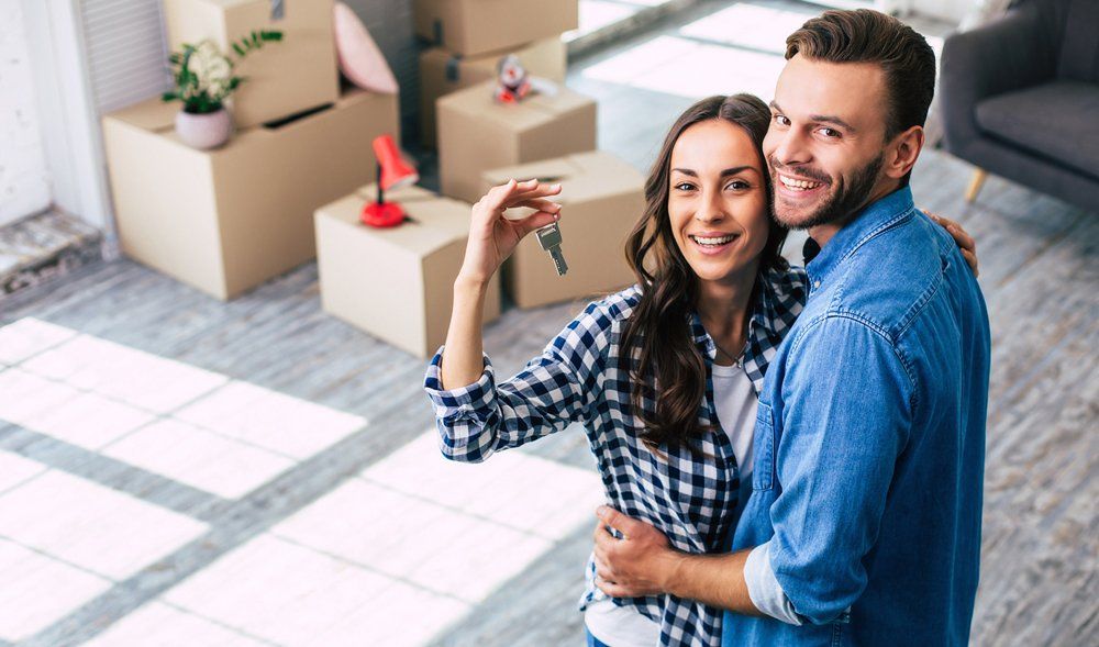 New Couple Inside Their New House — Fowler, CO — Total Concept