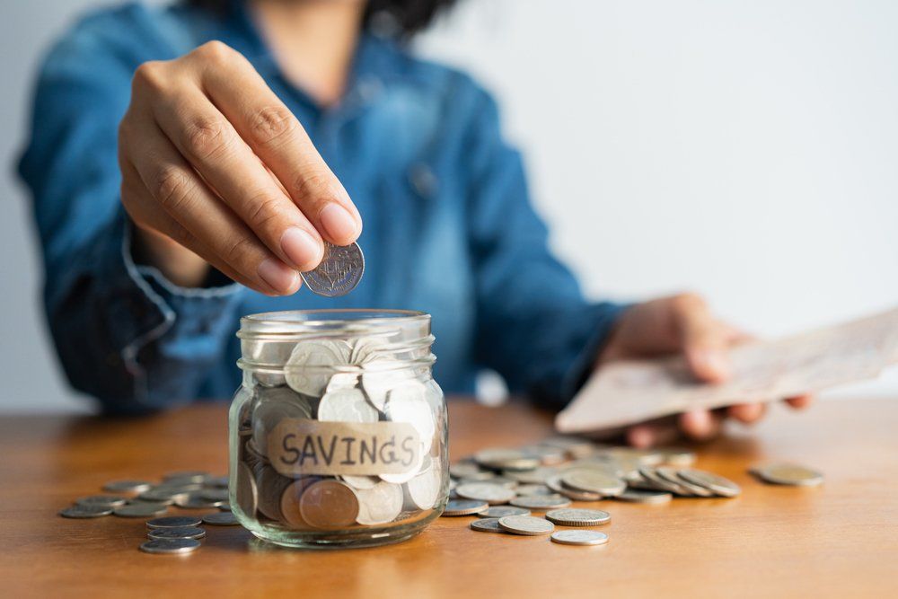 Woman Saving Up Coins — Fowler, CO — Total Concept