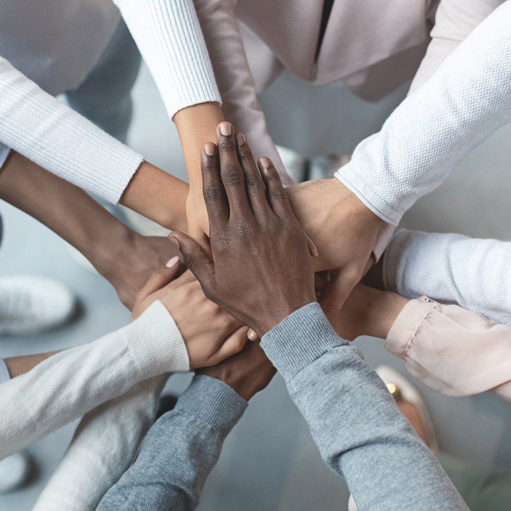 Team Putting Hands Together — Fowler, CO — Total Concept Team Putting Hands Together — Fowler, CO — Total Concept