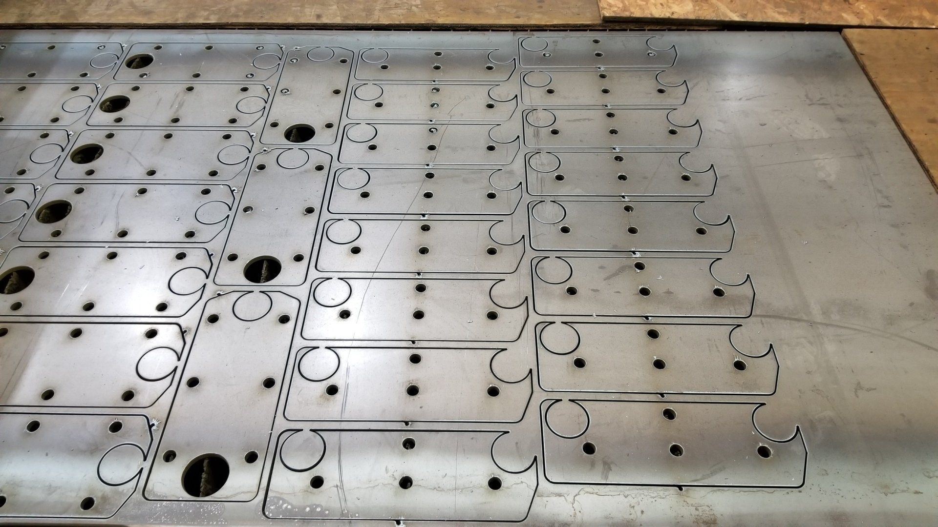 A bunch of pieces of metal with holes in them