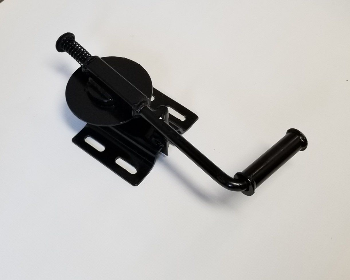 A black metal object is sitting on a white surface.