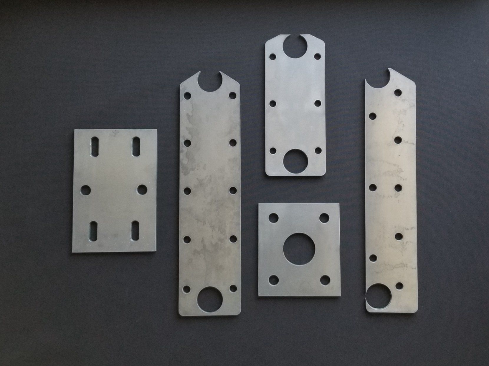 A bunch of metal plates with holes in them
