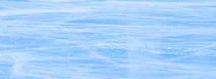 A close up of a blue water surface with waves