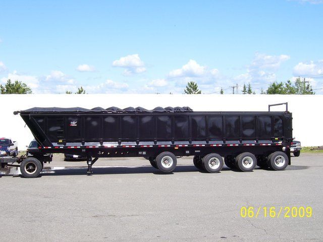 A dump truck is parked in a parking lot on 6/16/2009