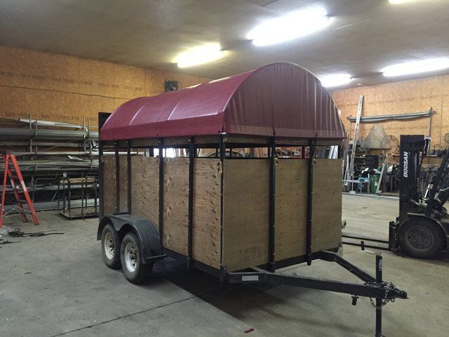 A trailer with a red awning on top of it