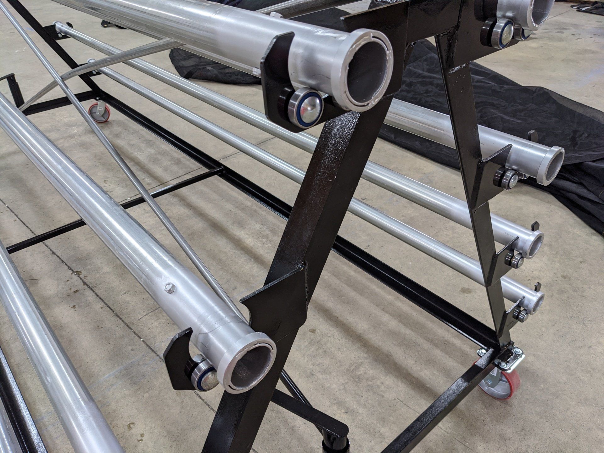A bunch of metal pipes are stacked on top of each other