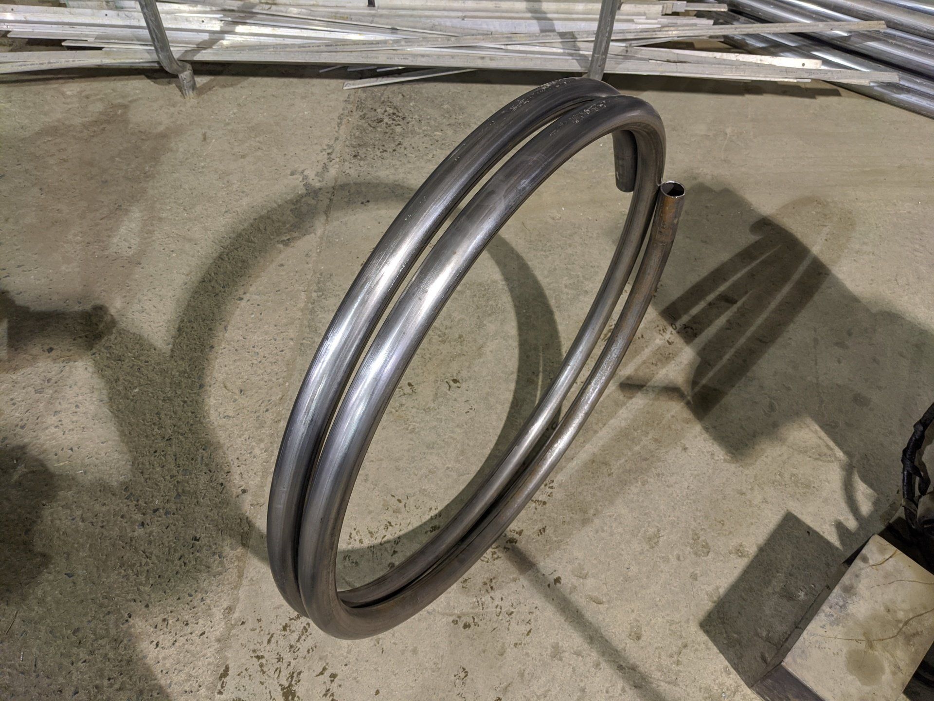 A close up of a metal ring on a concrete surface.