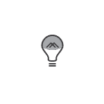 A light bulb with a mountain in the middle of it.