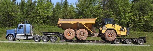 COVER-TECH INC. FREIGHT & LOGISTICS DIVISION Heavy Equipment Hauling