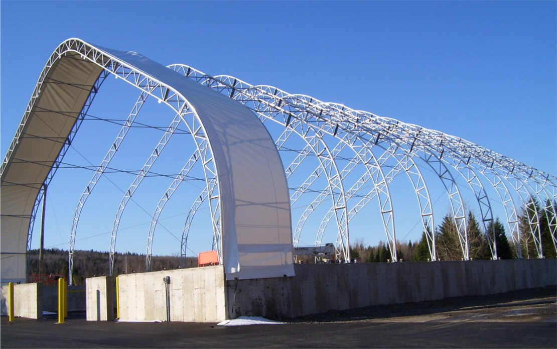 A large white structure with a blue sky in the background