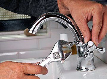 Plumbing — Plumber Fixing Faucet in Clinton, MO Plumbing — Plumber Fixing Faucet in Clinton, MO
