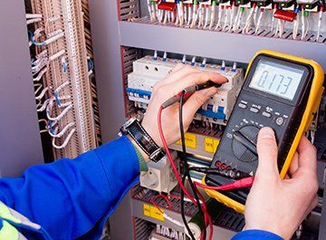Electrical Contractor — Electrician Using Multi meter in Clinton, MO Electrical Contractor — Electrician Using Multi meter in Clinton, MO