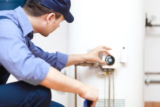 worker testing a boiler