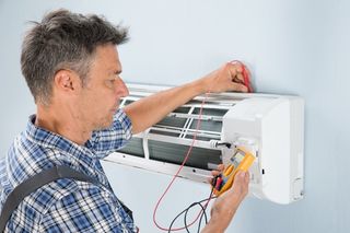 worker testing ac unit