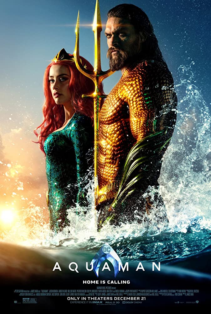 A movie poster for aquaman shows a man and a woman standing next to each other in the ocean.