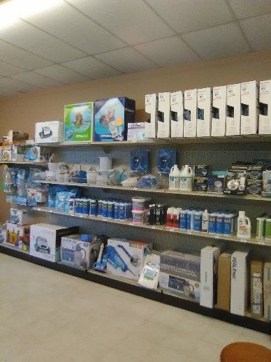 Shelves in a store filled with pool and spa supplies.