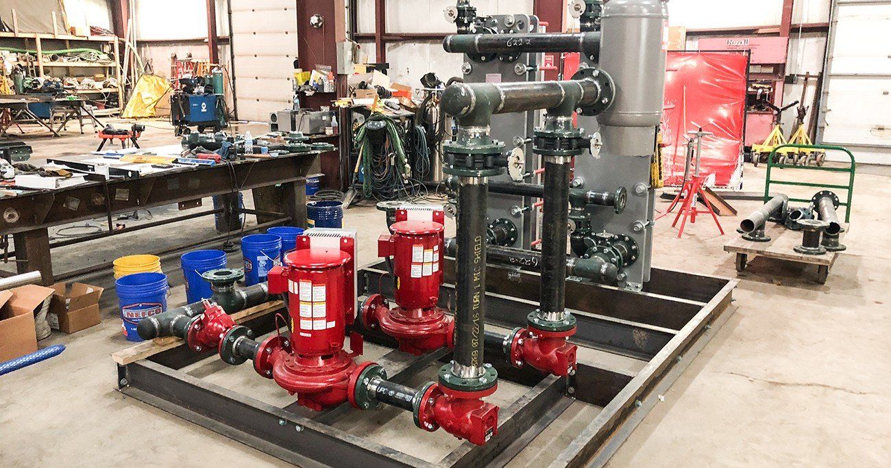 A bunch of pipes are sitting on top of each other in a room.