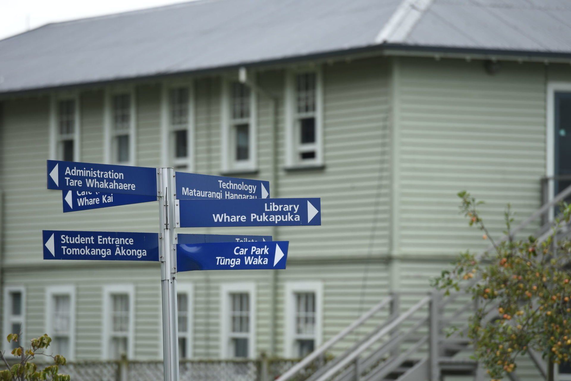 Timaru Girls Hig School | A building with stairs and signs pointing in different directions