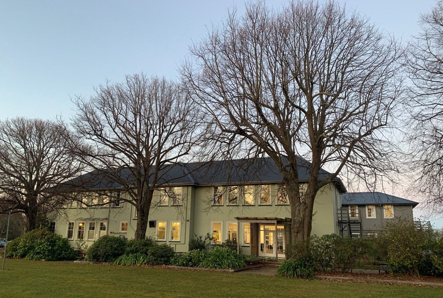 Timaru Girls Hig School | A large house with a lot of windows and trees in front of it.