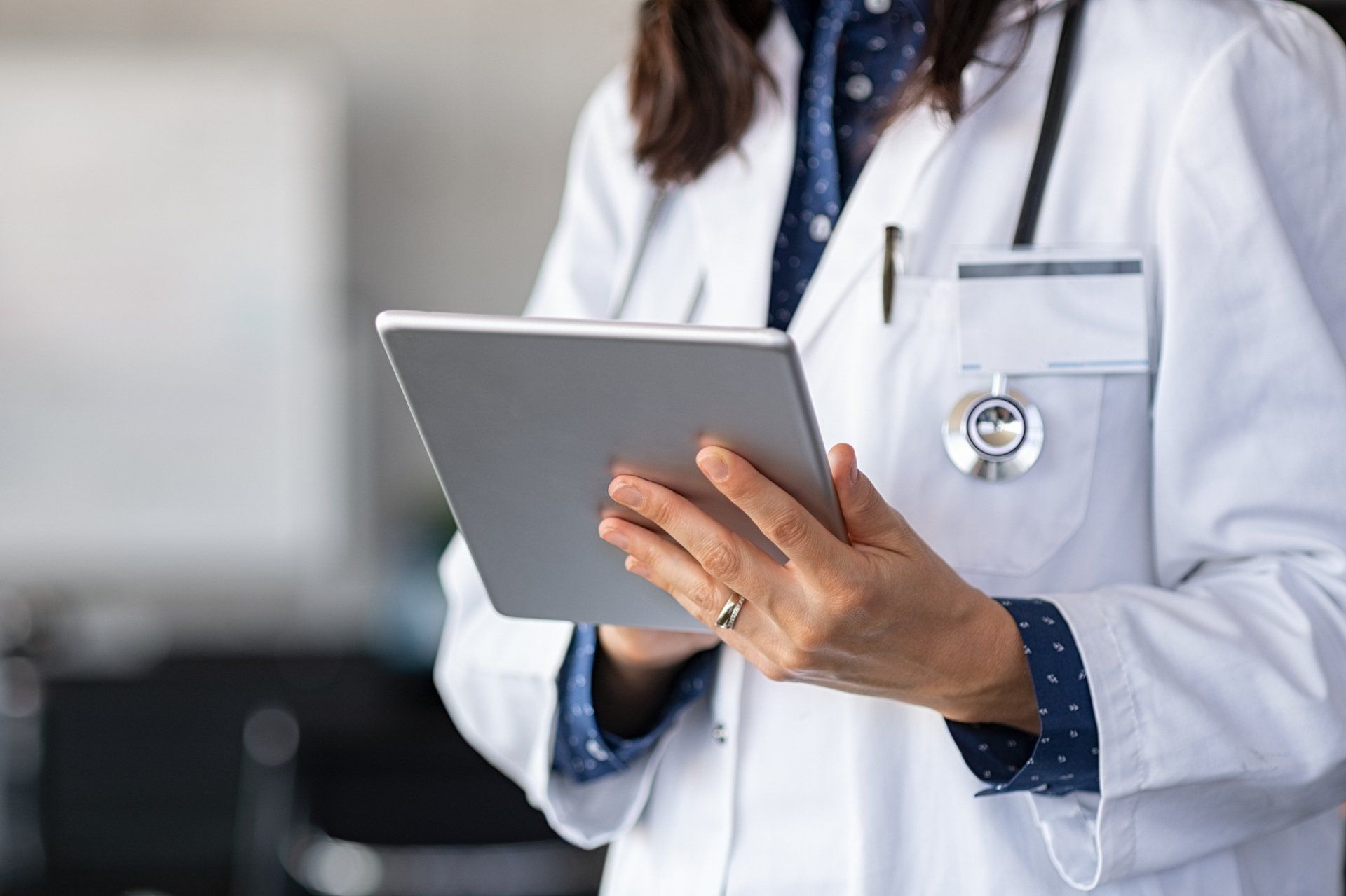 Doctor using digital tablet - Grand Rapids, MI - Urology Associates of Grand Rapids, PC